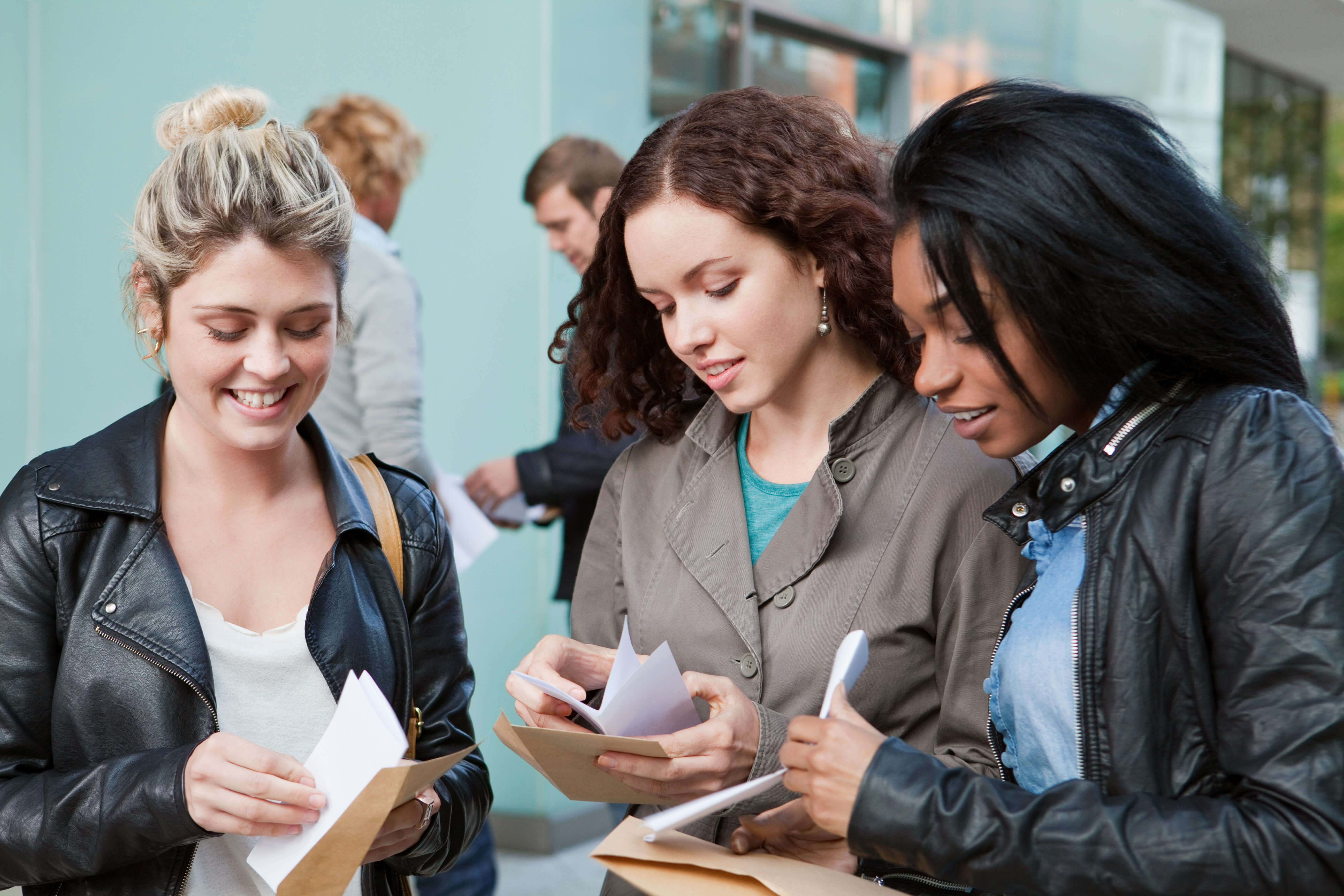students looking at exam results