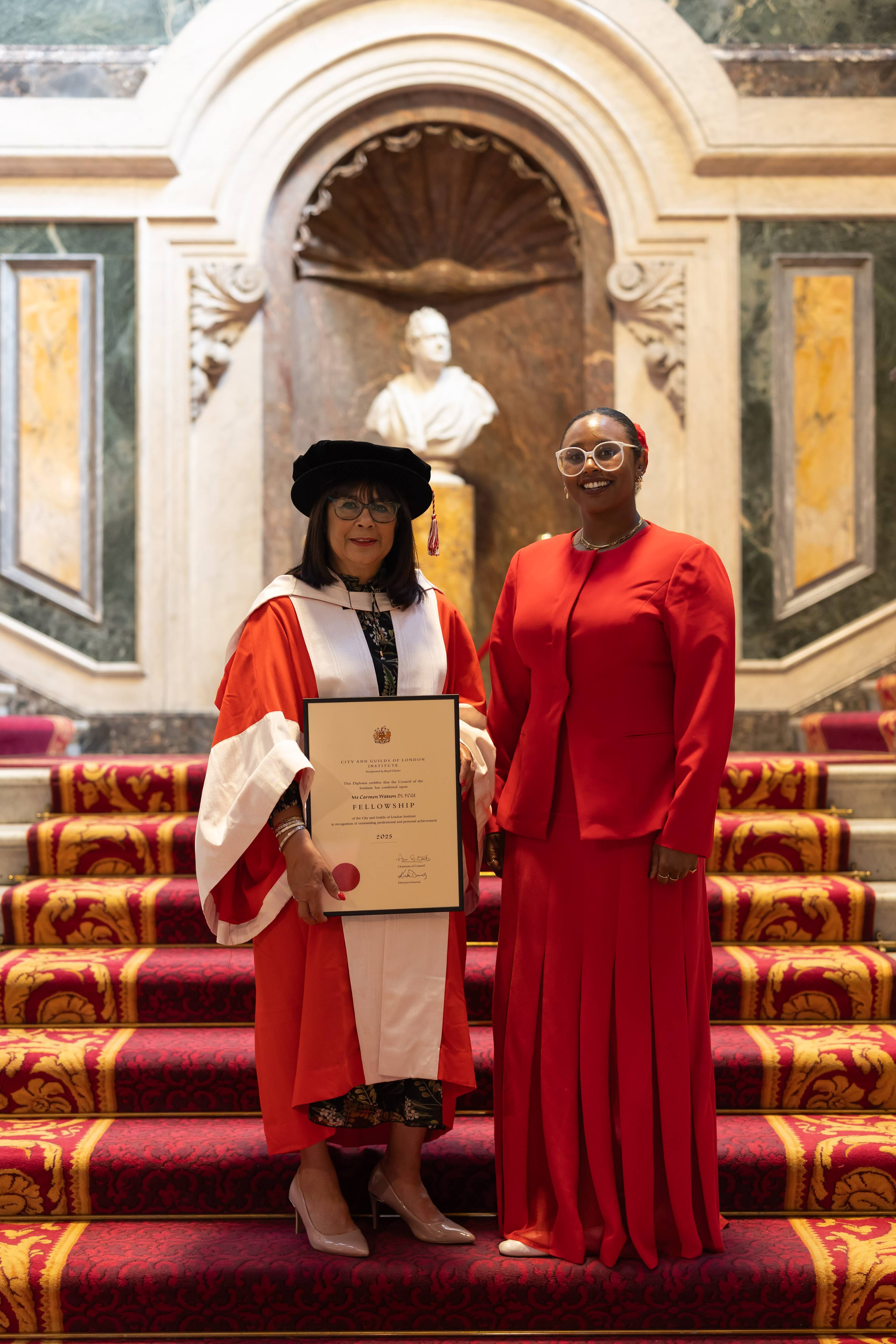 Carmen Watson receiving recognition of her lifelong dedication to promoting learning and development.