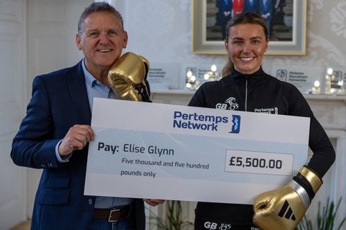 Elise Glynn with a £5,500 cheque 
