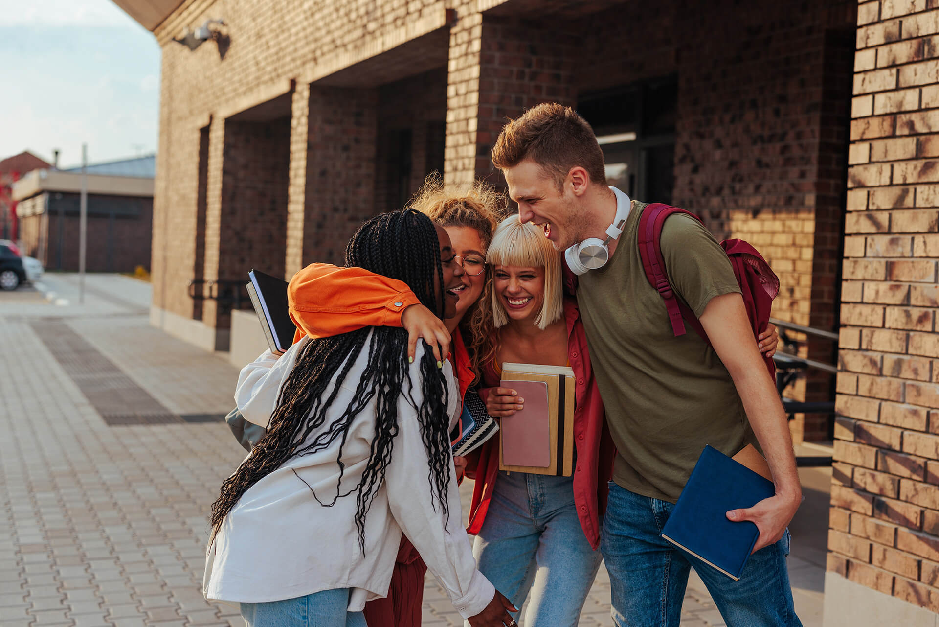 A-level students  hugging one another 