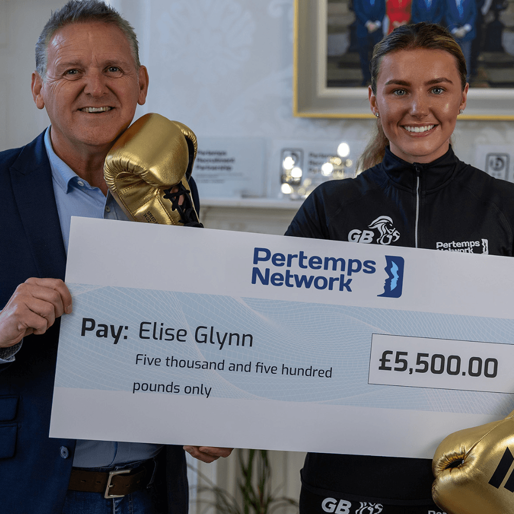 Elise Glynn with a £5,500 cheque
